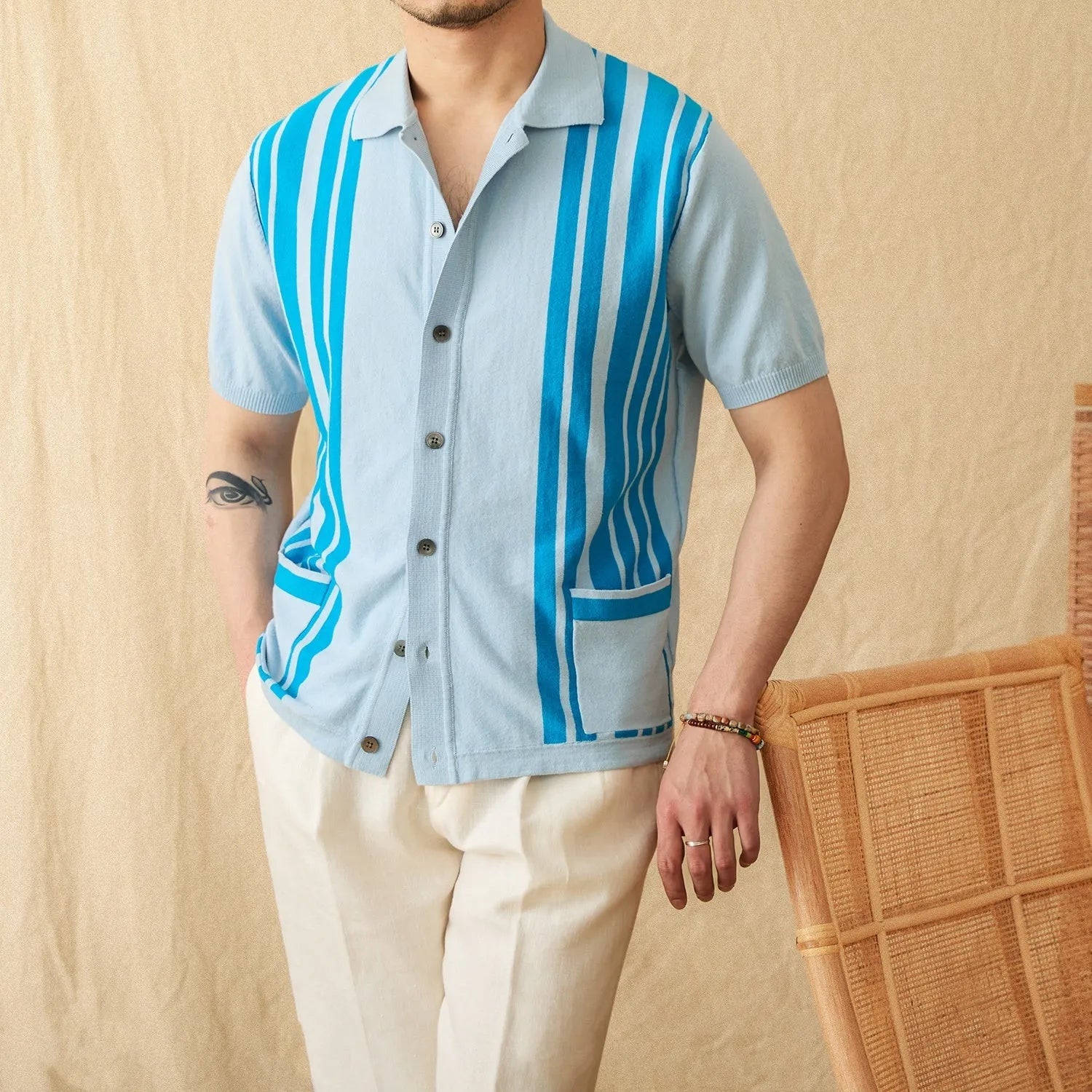 Striped knitted polo cardigan with lapel collar and short sleeves in cotton blend fabric