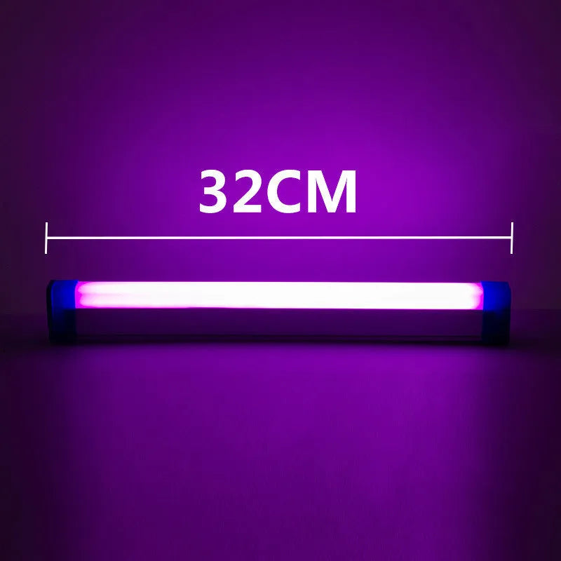 Blue and purple rechargeable LED tube light with USB cable on a dark background.