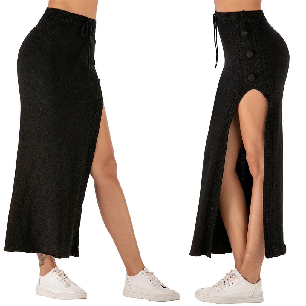A woman wearing a grey slim-fit acrylic skirt with a split and strap design.