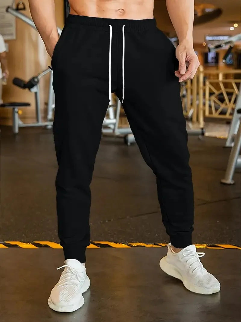 Men's loose-fit linen style leisure trousers with an elastic drawstring waist.