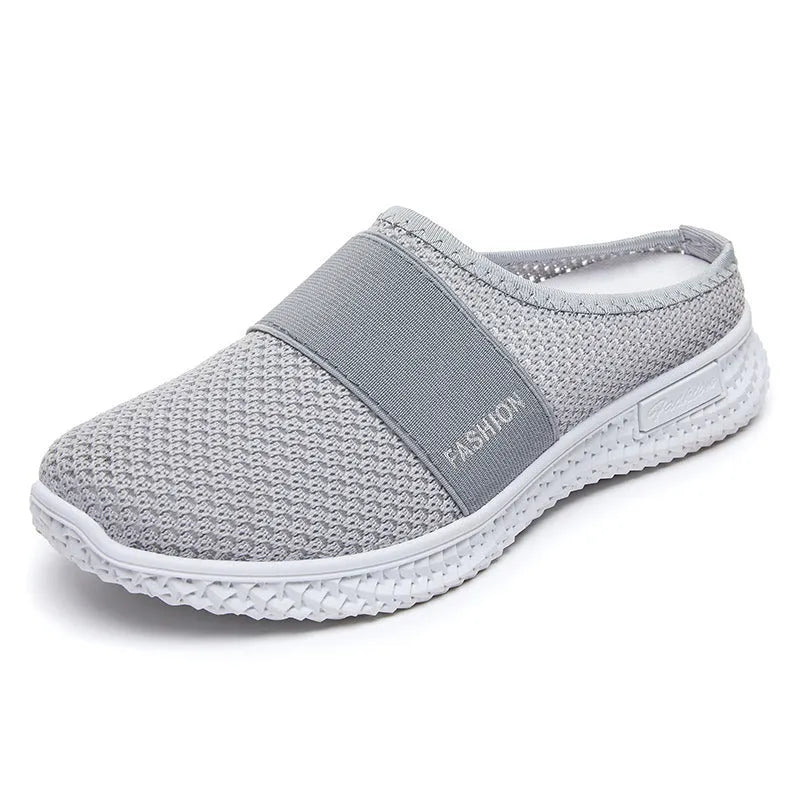 Women's flat-heel casual shoes in mesh material, showing round toe and hollow-out design in black colour.