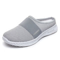 Women's flat-heel casual shoes in mesh material, showing round toe and hollow-out design in black colour.