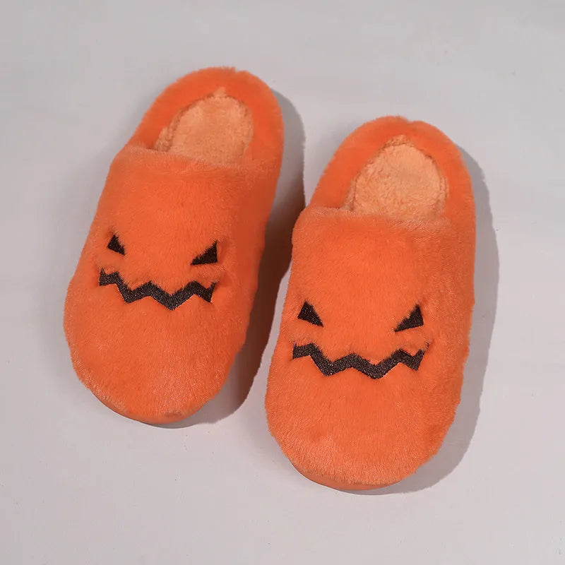 Orange Halloween pumpkin slippers with plush construction and non-slip soles in paired adult sizes