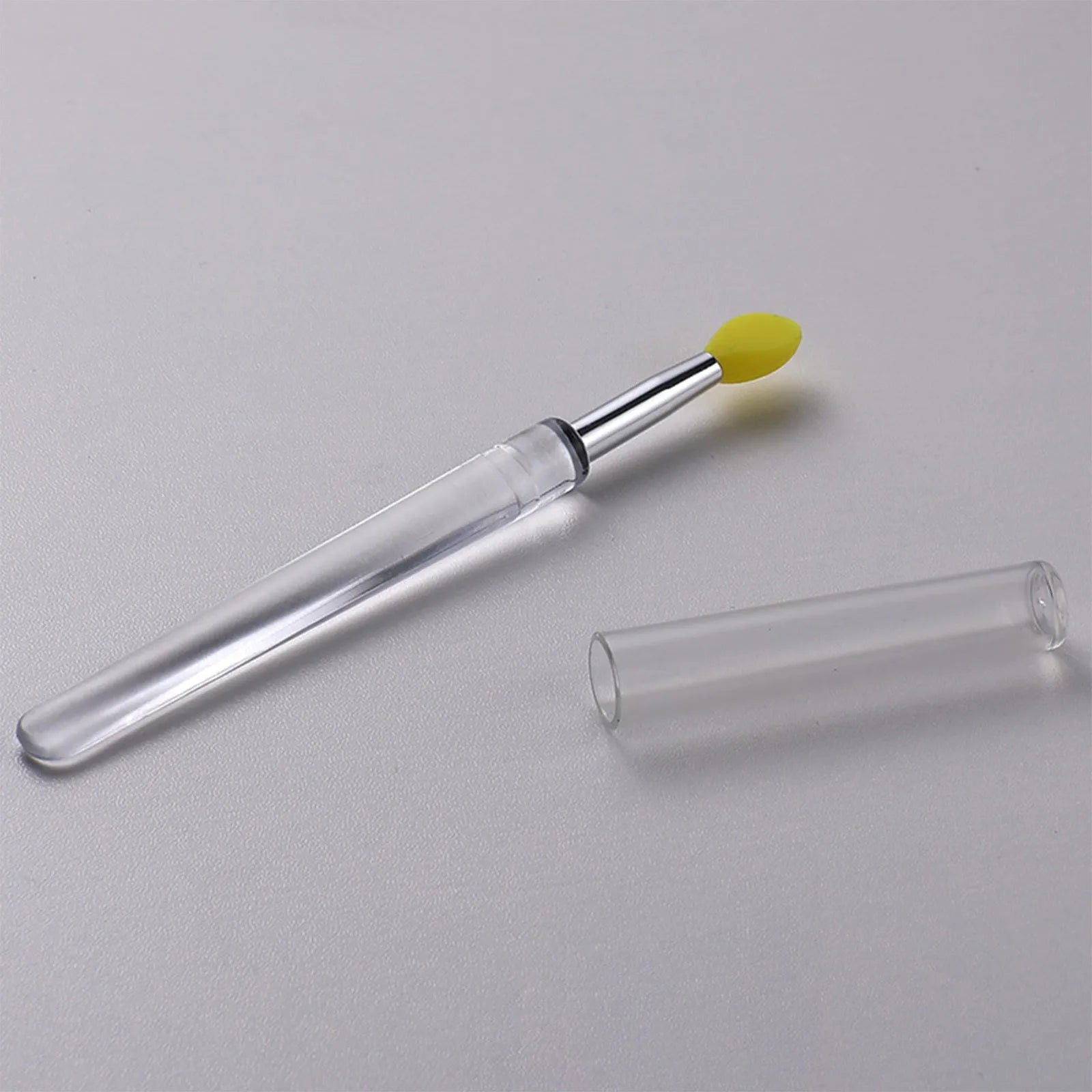 Set of reusable silicone lip brushes with protective caps in various colours