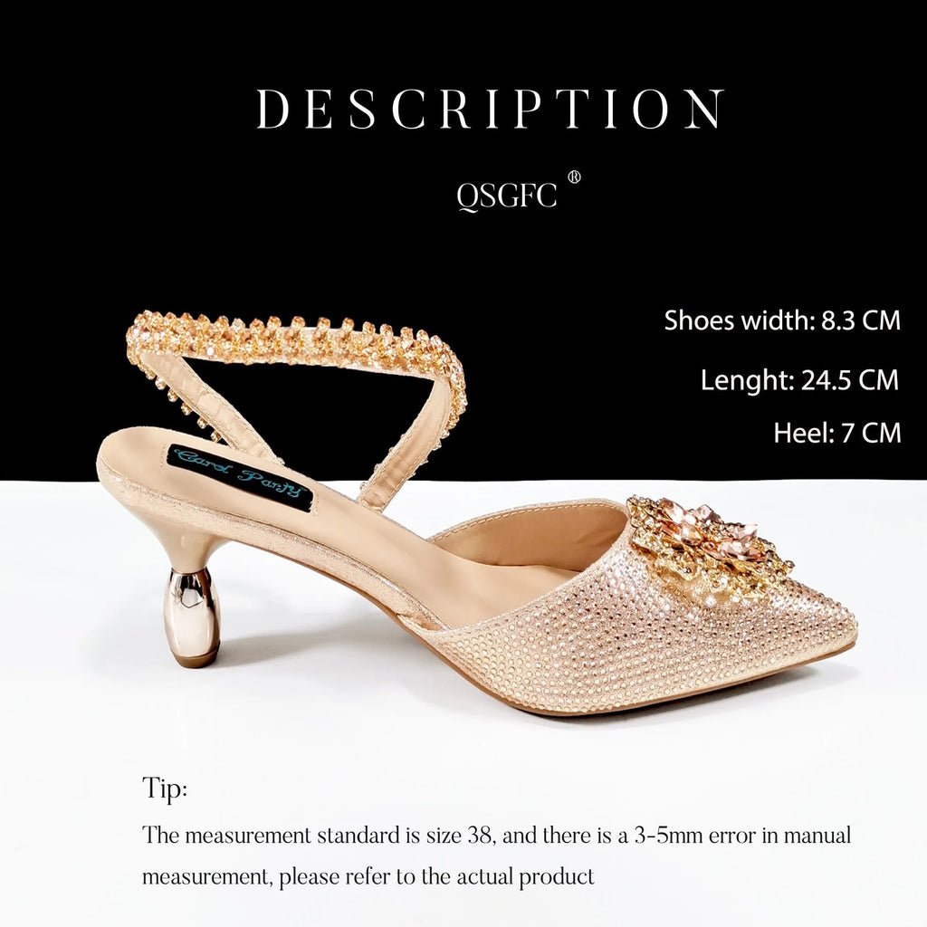 Women's black high heel sandals with ankle chain, floral rhinestone detail, and matching hard clutch bag