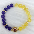 Handmade women's crystal bracelet with yellow and purple amethyst stones