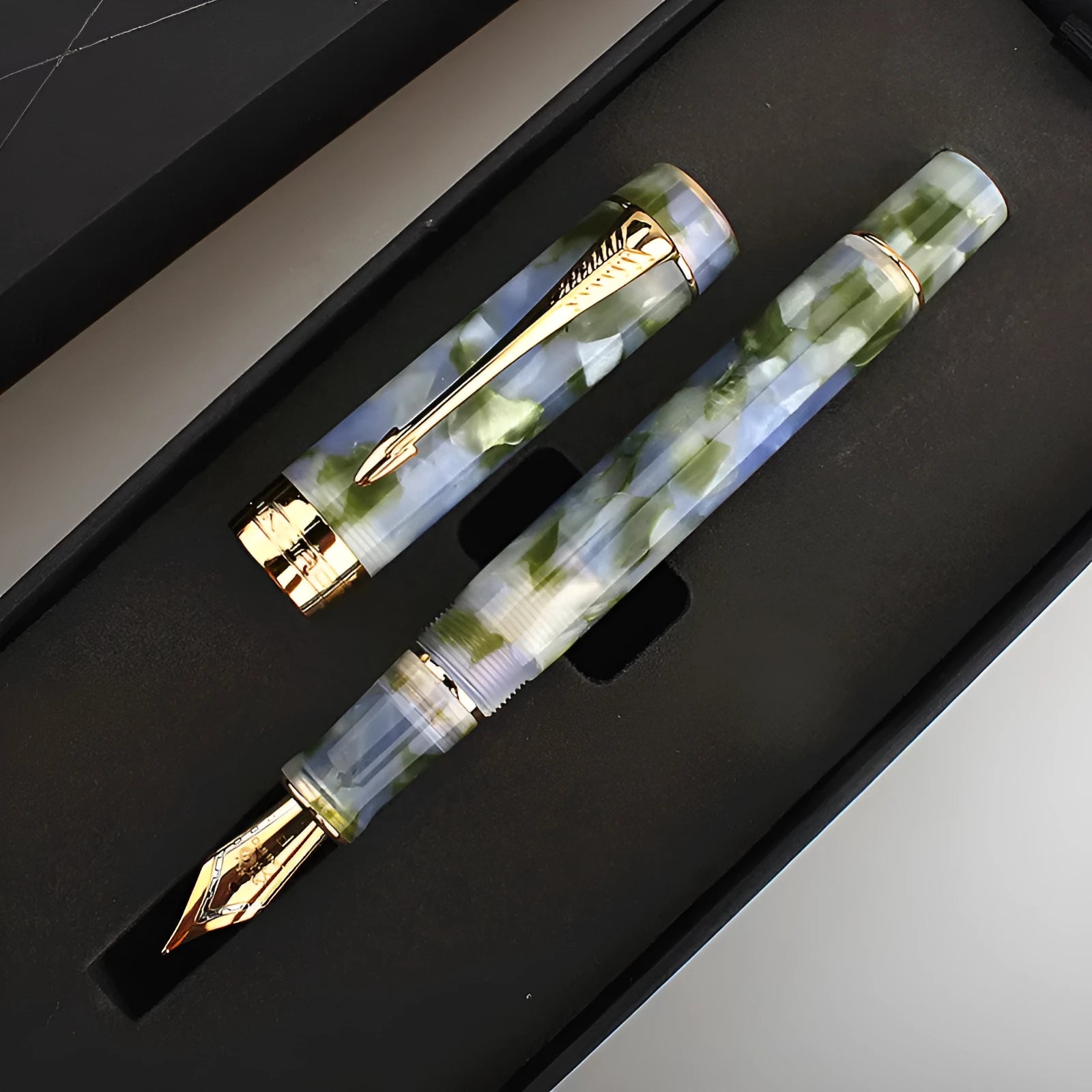 Deep bath green metal ballpoint pen showing three tip options: 0.5mm fine, 0.7mm medium, and 1.0mm art tip