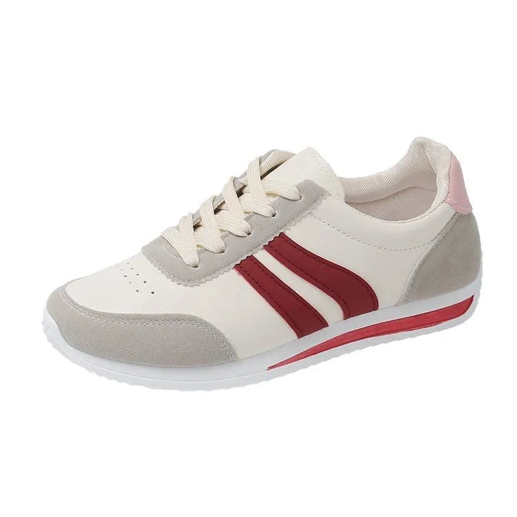 Red and blue low-top lace-up casual sneakers with a round toe and rubber sole.