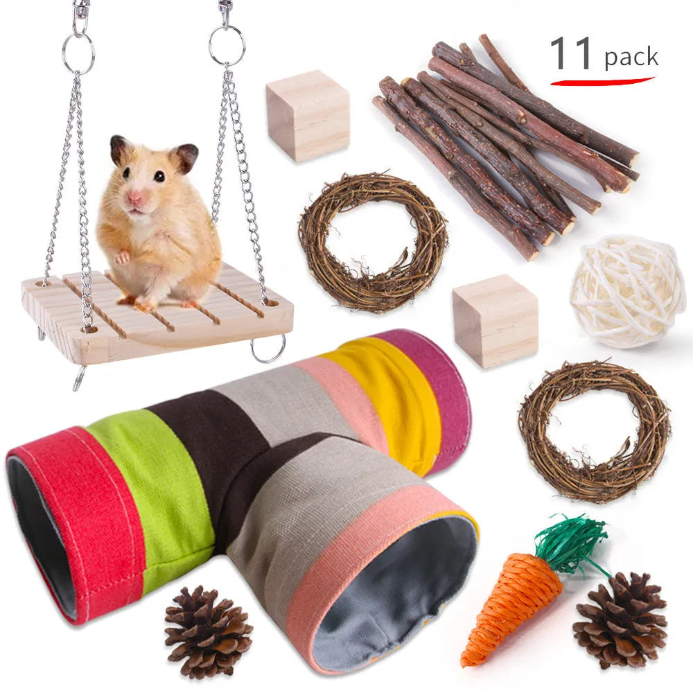 Assortment of wooden and natural fibre chewing toys for pet rabbits, guinea pigs, and parrots on a straw mat