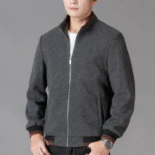A grey men's sporty fleece jacket with long sleeves and a stick pocket, shown on a hanger.