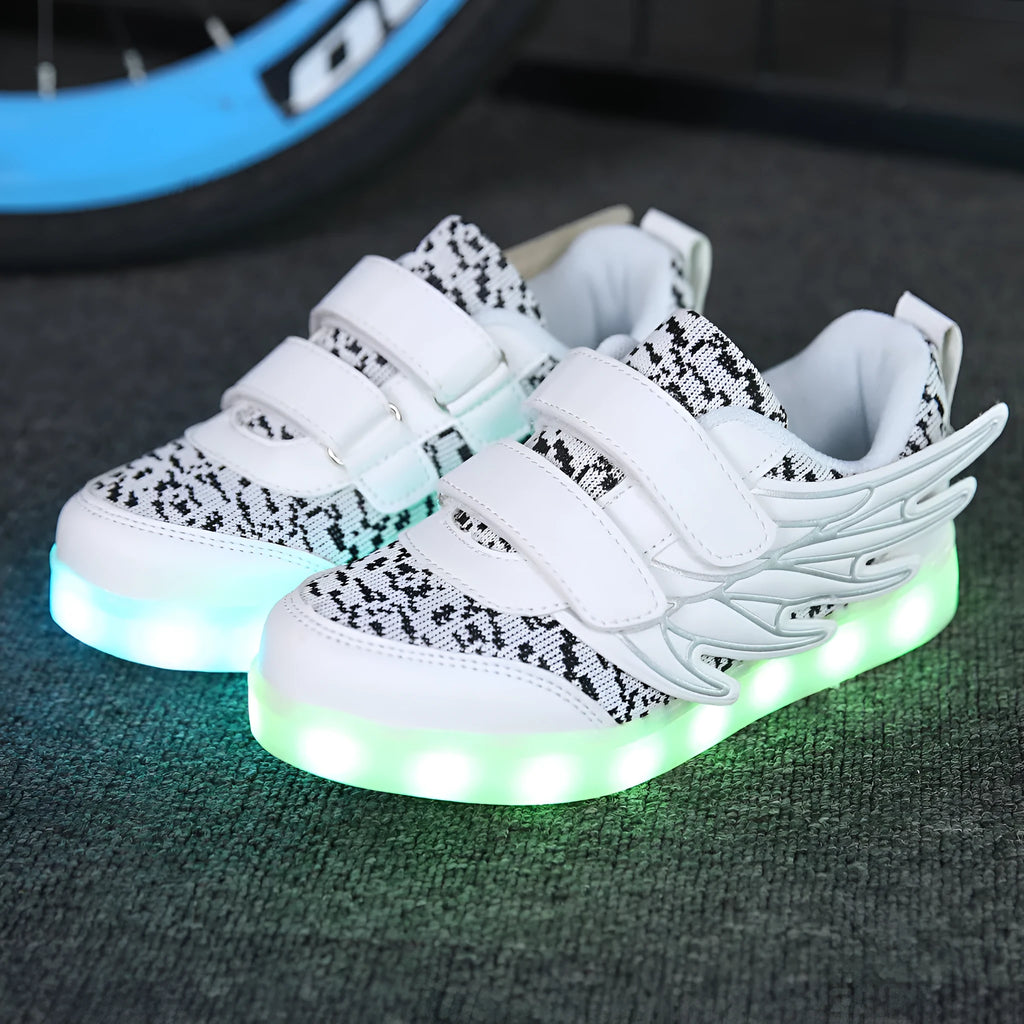 Children's plum red and white LED light-up sneakers with USB charging port and mode switch.