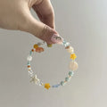 Orange water-soaked colour beach bracelet with diamond-shaped design and round elements