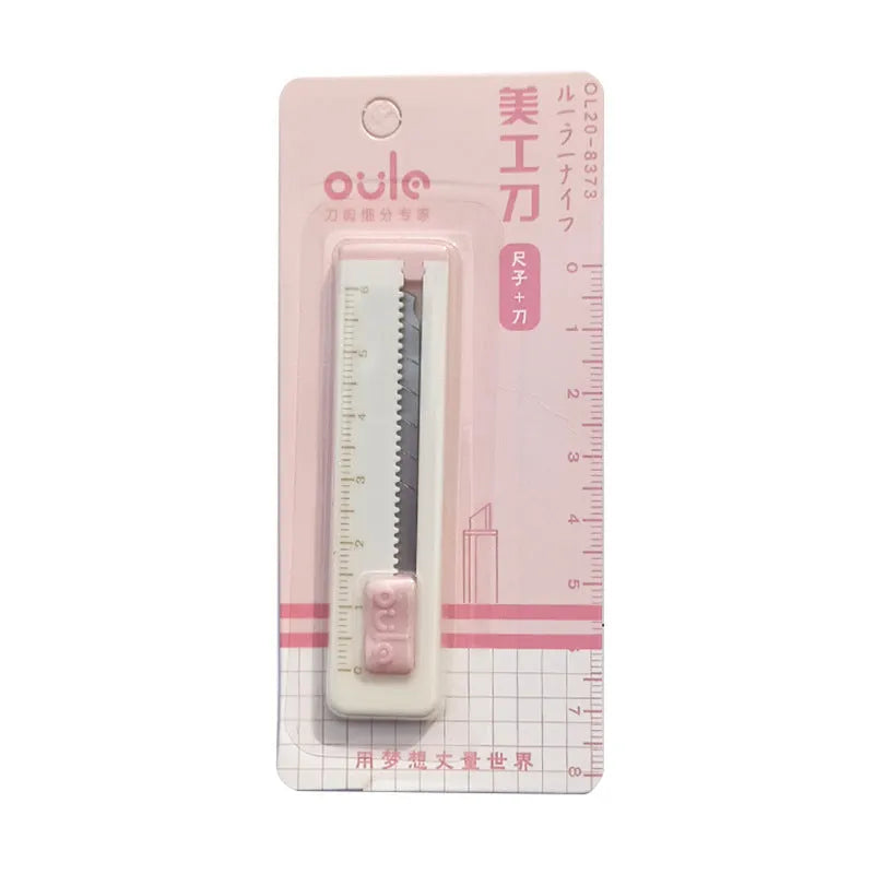 Small plastic-bladed art knife in blue, shown next to a ruler indicating its 7.2cm length.