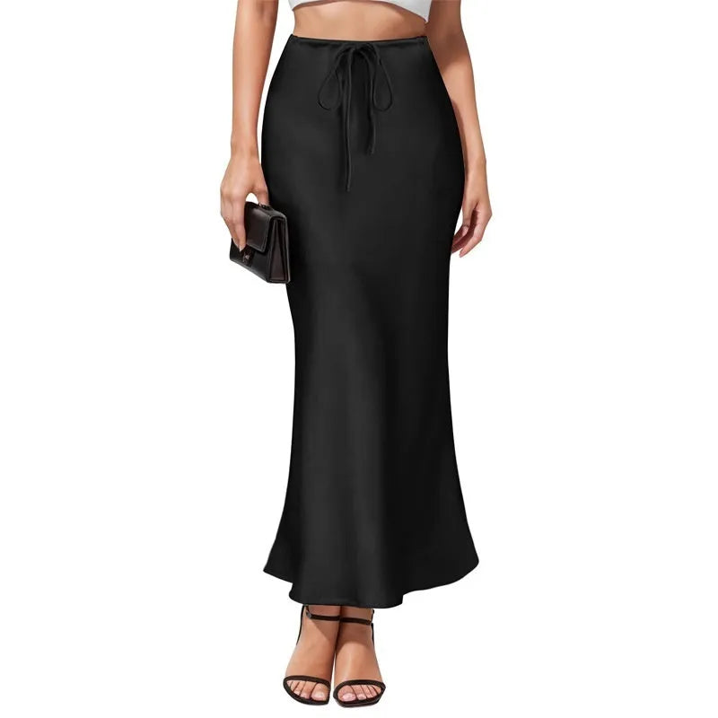 High-waisted asymmetric acetate skirt in a solid colour with irregular stitching detail on the hem.