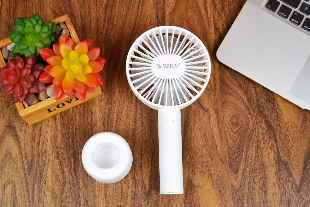 White ORICO FH1 portable USB desk fan with rechargeable battery on a desk