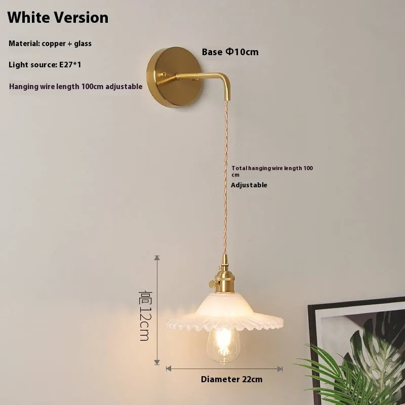 Copper retro lotus wall lamp with glass shade in amber colour variation