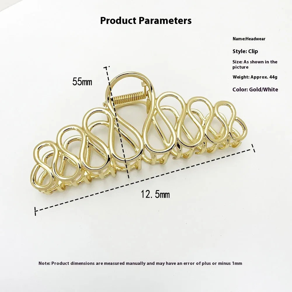 Large alloy hair clip with tassel design in gold electroplated finish for women's updo styling