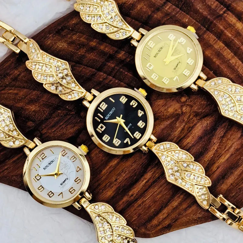 Women's stainless steel fashion watch with round gold dial and vachette clasp.