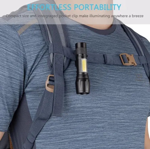 Black aluminium telescopic LED flashlight with pocket clip, shown zoomed in and out.