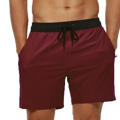 Men's blue training shorts with stitching waist detail and headband pocket for running and fitness