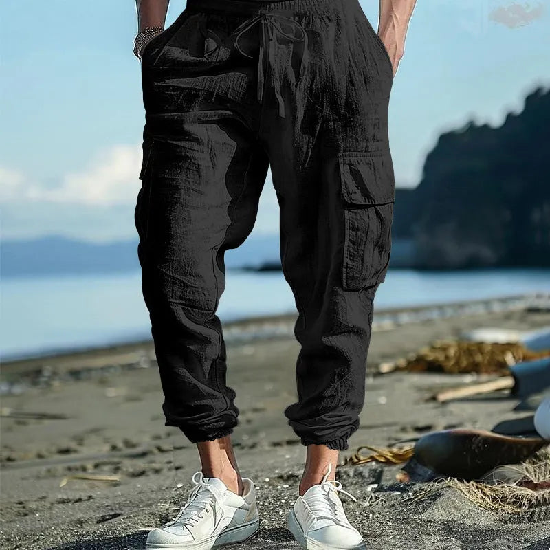 Men's linen casual trousers with drawstring waist and ankle-tied cuffs in solid colours