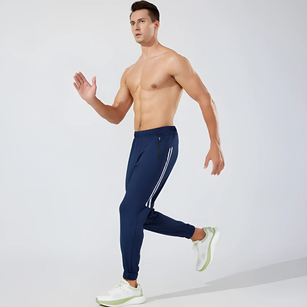 Men's black running trousers with mid-waist design and full-length polyester construction for sports
