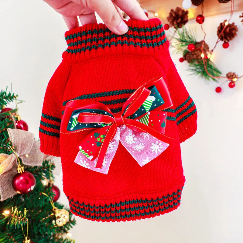 Red and green dog Christmas jumpers on a size chart showing XS, S, M, L, XL for pet weights 1kg to 9kg