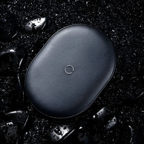 Baseus Rough 15W wireless charging pad in black colour on a desk surface
