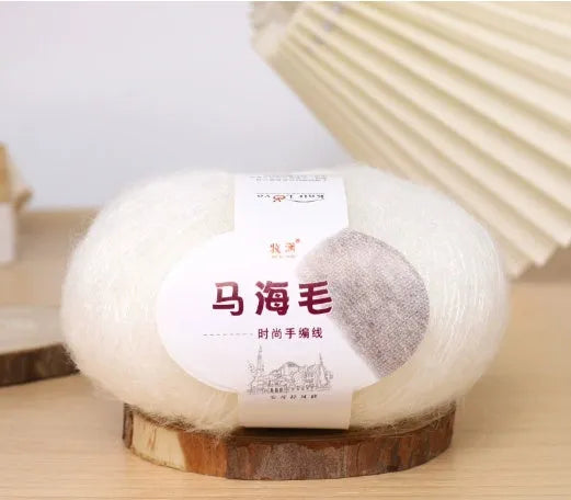 Single ball of mohair yarn in various colours for hand-woven DIY scarf knitting projects