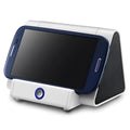 Compact black and white wireless Bluetooth mini speaker with control buttons.