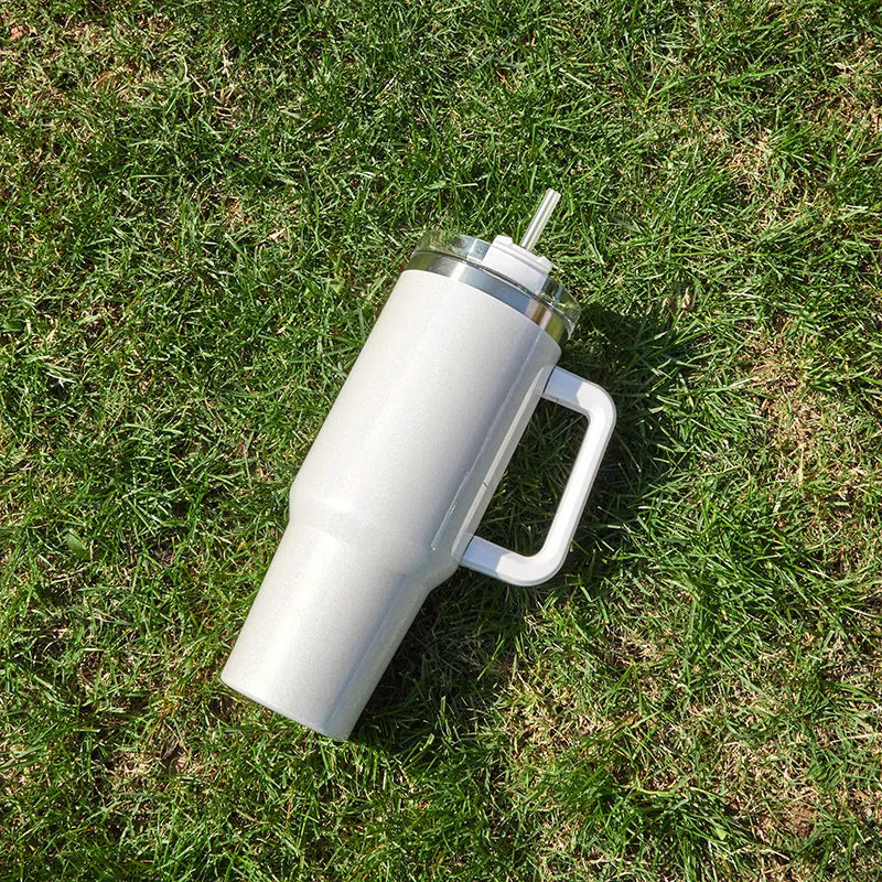 Large stainless steel vacuum insulated cup in a gradient colour option showing its height and simple style.