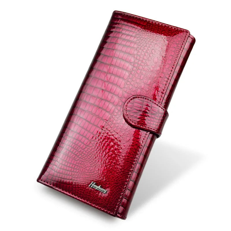 Women's leather coin purse with crocodile pattern texture in red colour showing pigskin lining
