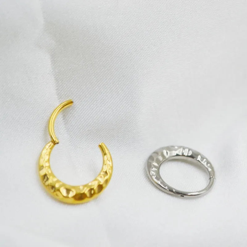 ASTM F136 titanium alloy nose ring with concave-convex carved design in gold or silver.