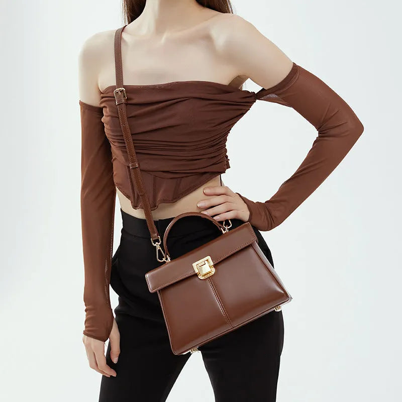 Women's black genuine leather shoulder handbag with vachette clasp in horizontal square shape