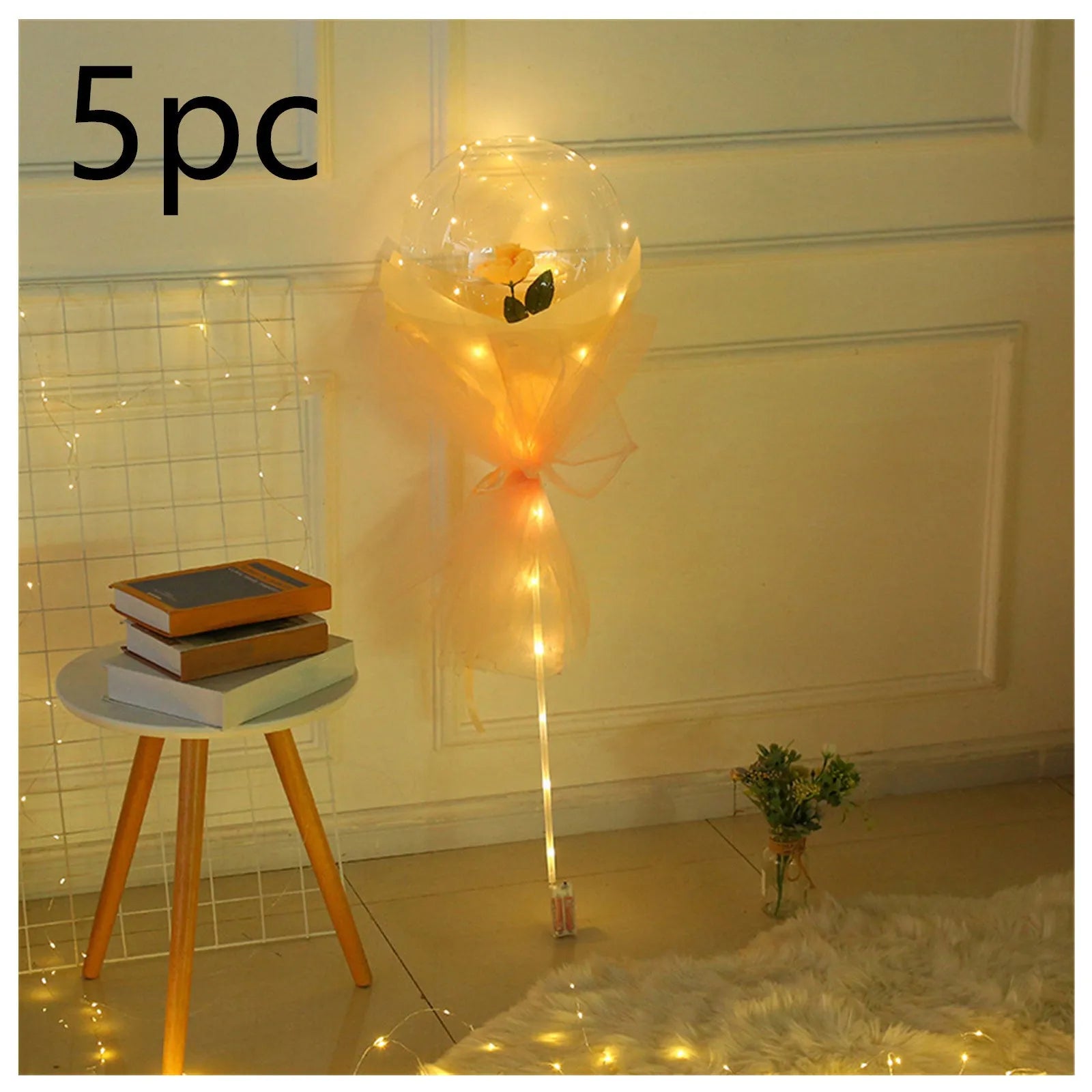 Transparent LED luminous balloon bouquet with artificial rose and glowing light inside, displayed as a DIY kit.