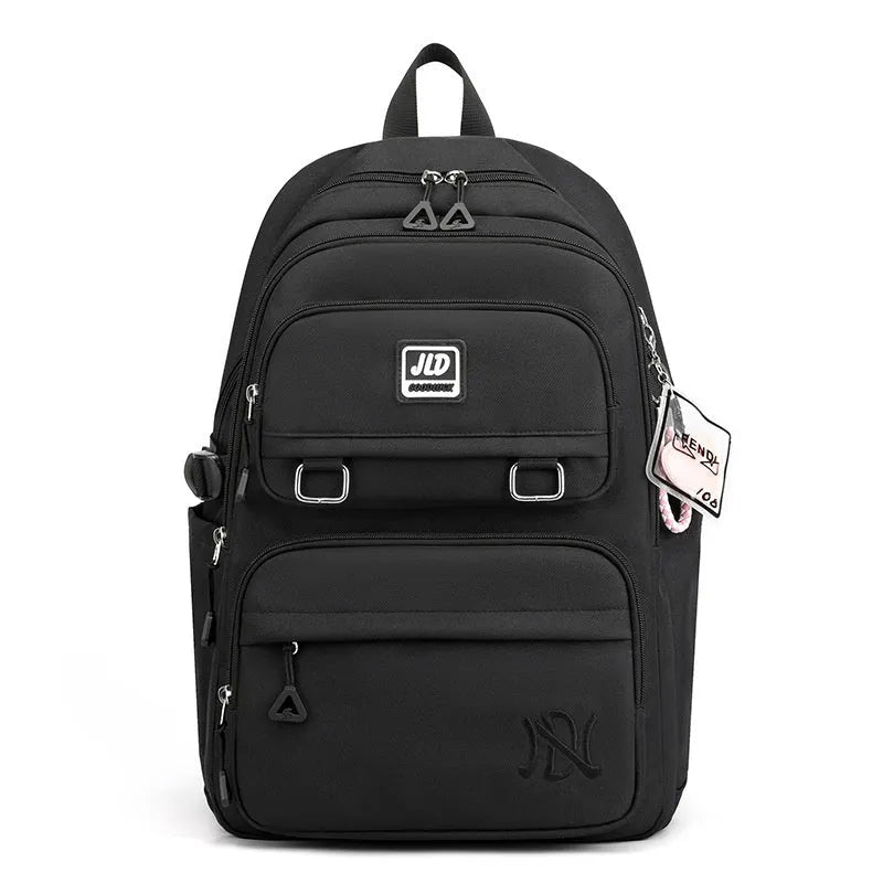 Large purple girls' nylon school backpack with a physiological curve backpanel on a white background.