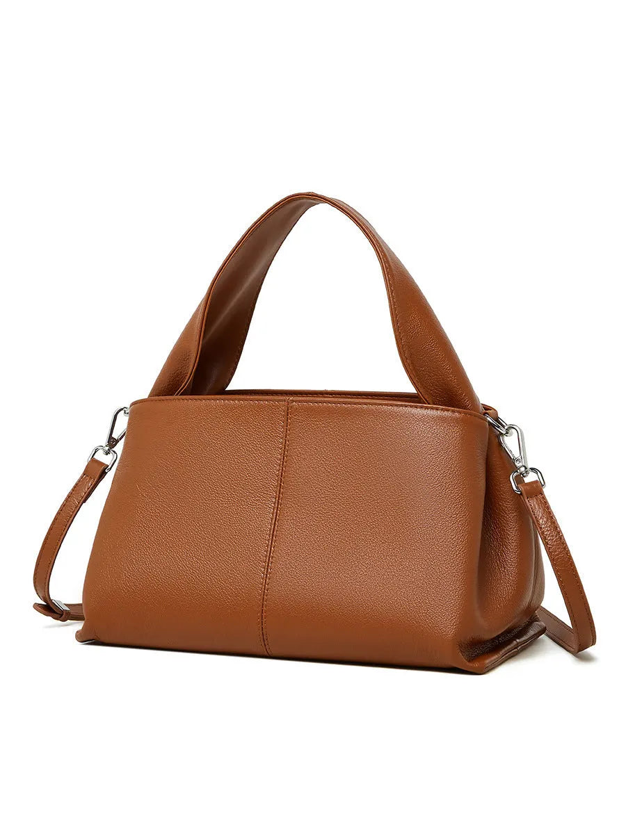 Women's genuine leather messenger bag in horizontal square shape with double shoulder strap, shown in apricot colour.