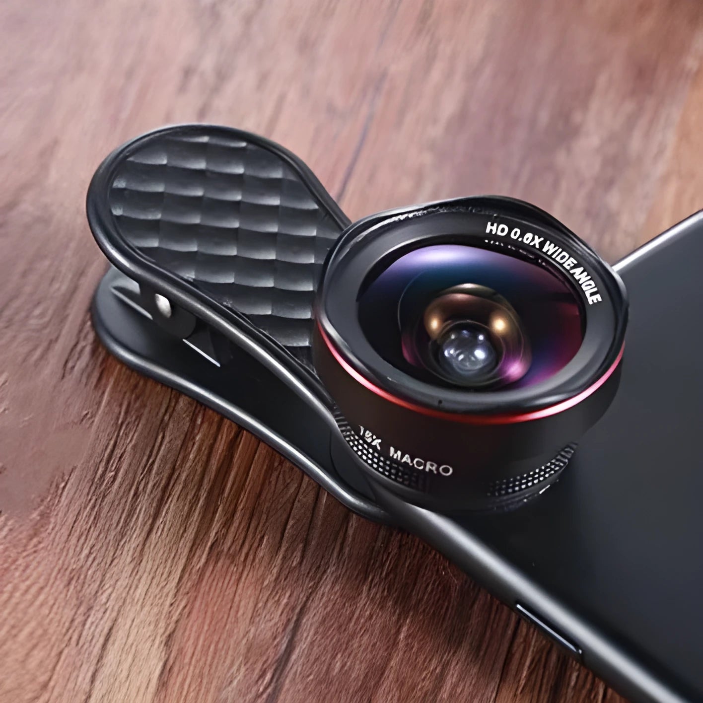 Black smartphone camera lens kit with wide-angle and macro lenses, clip attachment, and storage box