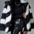 Women's faux fur coat with contrasting lapel detail and a detachable fur collar.