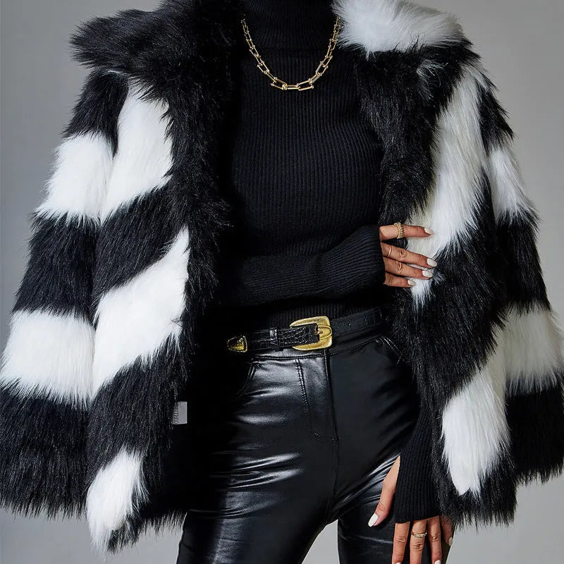 Women's faux fur coat with contrasting lapel detail and a detachable fur collar.