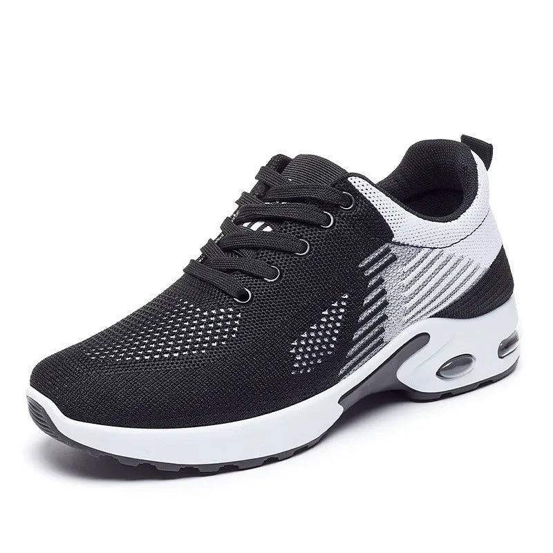 Women's pink Flyknit casual running shoes with mesh lining and flat heel on a white background