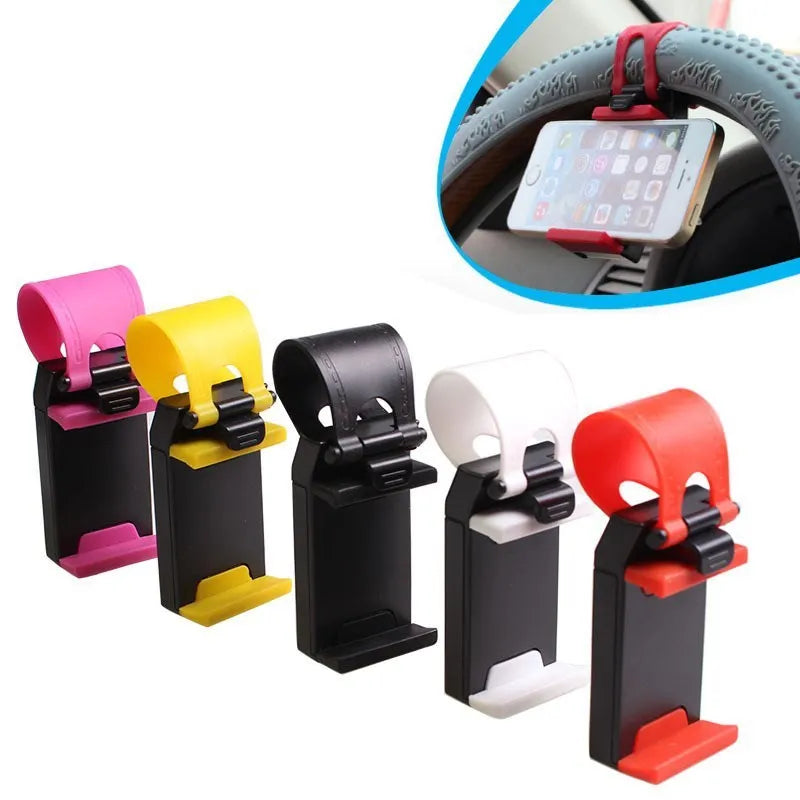 Black steering wheel phone holder clip mounted on car steering wheel holding a smartphone