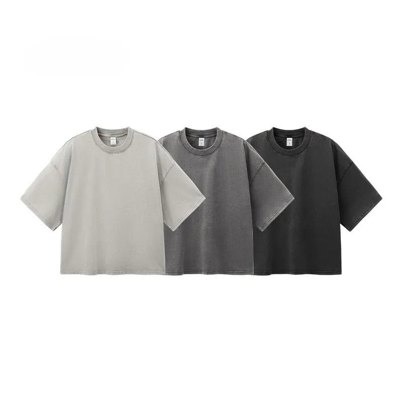 Men's vintage cotton t-shirt with washed-out treatment in khaki light colour showing loose fit and drop-shoulder sleeves