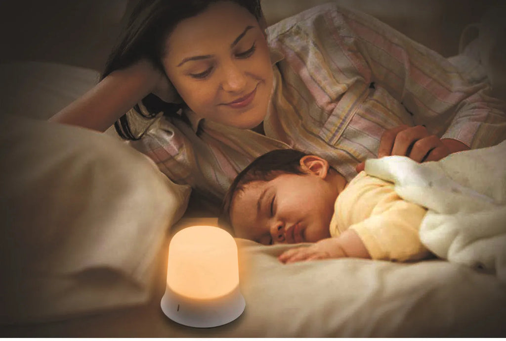 White touch-control bedside night light with rechargeable battery shown next to a USB cable.