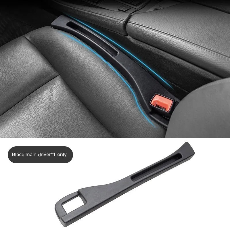 Black car gap storage box with handle positioned between car seats