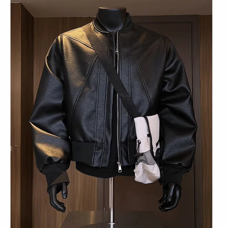 Men's black PU leather jacket with litchi grain texture, showing extended 100cm length and tight fit.