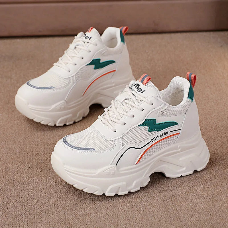 Beige women's lace-up dad shoes with cross straps and a round toe, on a white background.