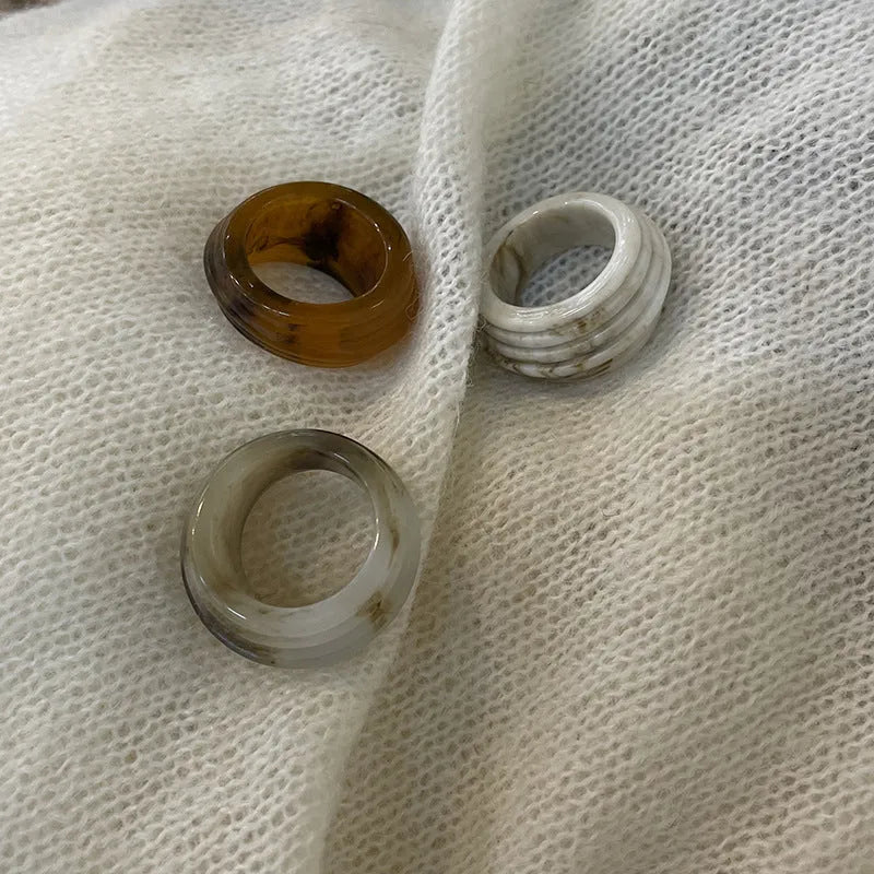 Geometric Chinese style resin ring in brown or white colour with irregular width design