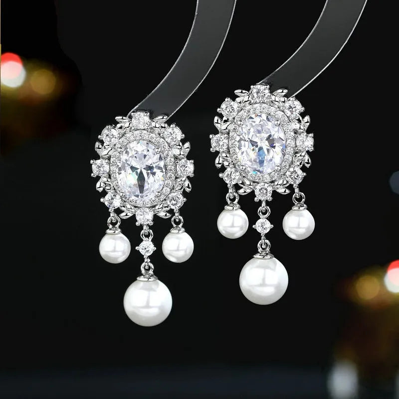 Oval geometric copper earrings with zircon inlays and pearl tassels in light purple colour option