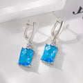 Square geometric copper earrings with electroplated gold finish and quadrilateral design elements